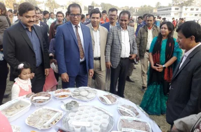Khulna Divisional Commissioner Lokman Hossain Mia, second from left, and other local administration officials at the Pitha Utsab in Jhenaidah | Dhaka Tribune