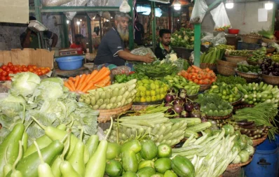 Sellers showcasing a variety of fresh vegetables for sale at a kitchen market in Dhaka on Friday, August 25, 2023. Photo: Focus Bangla