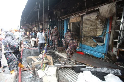 The photo shows members of Border Guard Bangladesh (BGB) joining rescue operation at the fire site at Mohammadpur Krishi Market on Thursday, September 14, 2023. Photo: Mehedi Hasan/Dhaka Tribune