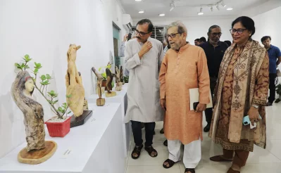 Akhtar Ahmed Rasha (L) is seen beside lawmaker Asaduzzaman Noor at the former’s solo exhibition titled ‘Drifting to the Root, Drifting to Love’ in Dhaka’s Dhanmondi. Photo: Mehedi Hasan/Dhaka Tribune