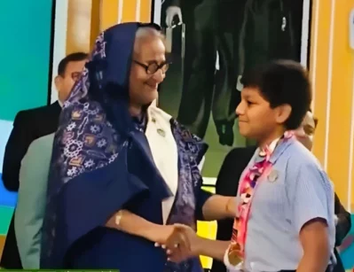 A student of South Point School receives an award from Prime Minister Sheikh Hasina on Sheikh Russell Day 2023 on October 18, 2023. Photo: Courtesy