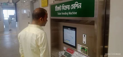 A man is seen purchasing a ticket from a vending machine at Motijheel Metro Rail Station in Dhaka on Sunday, November 5, 2023. Photo: Dhaka Tribune
