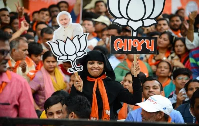 File photo: An Indian Muslim supporter of Bhartiya Janta Party holds a cutout of Indian PM Narendra Modi as she attends a rally in Ahmedabad on May 26, 2019. Photo: AFP