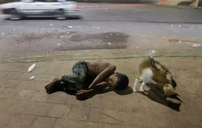 They say beggars cannot be choosers. Truly, the homeless do not have the option to choose how they live. Just like this child at TSC Chattar. These children sleep in the streets everyday, often joined by stray dogs. Photo: Dhaka Tribune