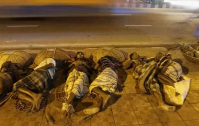 At late hours when the fortunate are sleeping peacefully on comfortable mattresses, thousands of homeless people sleep in the streets of Dhaka city. In this picture labourers are seen sleeping on a footpath only using their baskets as the head-rest in Kawran Bazar area.