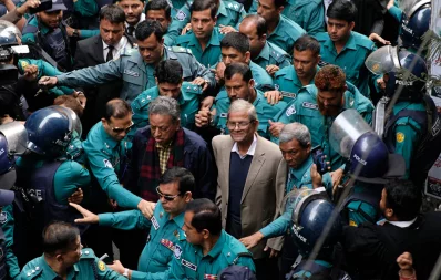 BNP Secretary General Mirza Fakhrul Islam Alamgir and Standing Committee Member Amir Khasru Mahmud Chowdhury are surrounded by policemen on the premises of the Chief Metropolitan Magistrate Court in Dhaka on Monday, December 18, 2023. Photo: Mahmud Hossain Opu/Dhaka Tribune