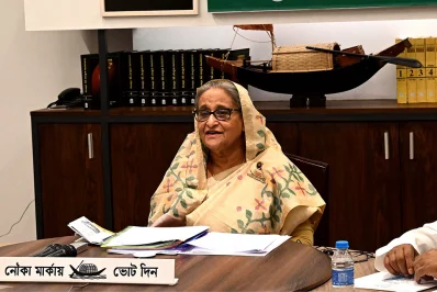 Prime Minister Sheikh Hasina is seen addressing six public rallies in as many districts simultaneously through video links from her party’s office at Tejgaon, Dhaka on Saturday, December 23, 2023. Photo: PID