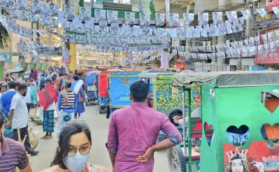 A street is decorated with posters of various candidates for Comilla city corporation election. Photo: Dhaka Tribune