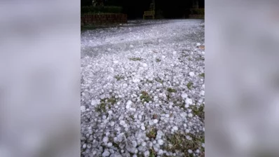A road is filled with hailstones the size of cricket balls in Purbachal on Sunday, March 24, 2024. Photo: Dhaka Tribune