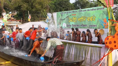 The image shows young men and women splashing water at each other at Sangrai Festival which is held in Bandarban on Monday, April 15, 2024. Photo: Dhaka Tribune