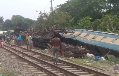 People are seen near the affected commuter train that collided with an oil-laden freight train in Gazipur on Friday, May 4, 2024. Photo: Dhaka Tribune