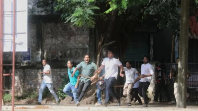 A group is seen with sticks after a clash broke out at Dhaka University on Monday, July 15, 2024. Photo: Ahadul Karim Khan/Dhaka Tribune