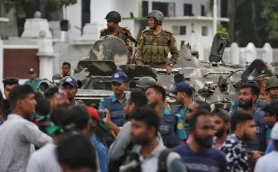 A large force of police officers, military APCs, and water cannons has been stationed