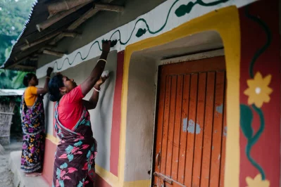 Santal women artists showing their traditional wall painting (Alpona - colourful motif) skills in Rajshahi`s Godagari. Photo: Reaz Ahmad and Brac