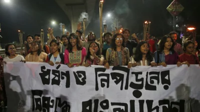 Students organized a protest and torchlight procession at the Dhaka University campus on Tuesday, February 25, 2025, demanding effective measures to end rape and violence against women, as well as to ensure the prosecution of the perpetrators. Photo: Mehedi Hasan/Dhaka Tribune