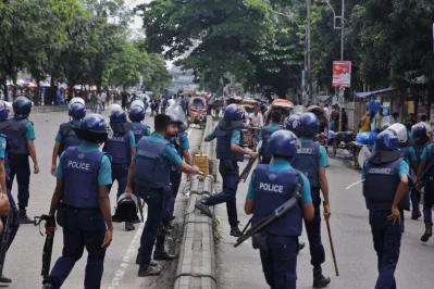 A clash is happening between Dhaka College and City College students in New Market around 11:30 am, with police intervening using baton charges and sound grenades. Photo: Mehedi Hasan/Dhaka Tribune.