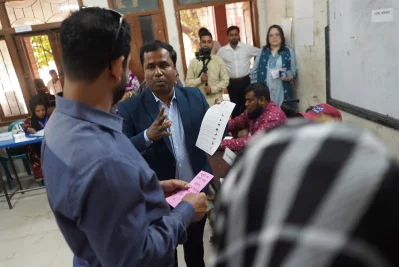 A mock polling station for persons with disabilities, featuring sign language interpretation support.