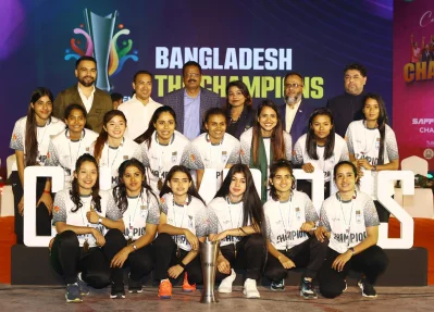 Fahad Karim celebrates with SAFF Women’s Futsal champions team early this year