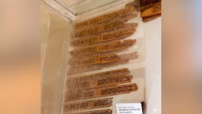 The image shows a collection of palm-leaf manuscripts (known as talpatar puthi in Bengali) preserved and displayed in the museum. Traditionally, such manuscripts were written on dried palm leaves, which were a common writing medium in South Asia before the widespread use of paper. Photo: Dhaka Tribune