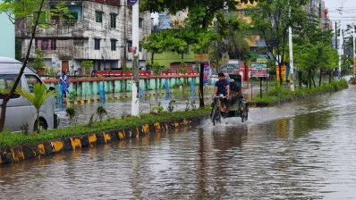 An autorickshaw on a waterlogged road in Khulna on Thursday, July 9, 2026. Photo: Dhaka Tribune