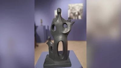 A dark-patina piece from Novera Ahmed`s iconic Family Series on display at the exhibition. This piece presents a highly stylized, abstract interpretation of a family unit. It features an elongated, central parental figure cradling a tiny child on its shoulder, flanked by a smaller accompanying figure to the lower left. Photo: Collected/Dhaka Tribune