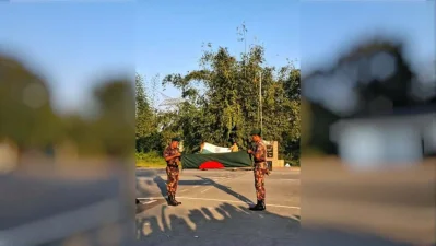 Border Guard Bangladesh (BGB) personnel in the foreground are meticulously folding the Bangladeshi flag, while Indian Border Security Force (BSF) personnel in the background perform the exact same protocol with the Indian flag. Once carefully folded, the flags are securely stored overnight before being raised again at sunrise the following morning.