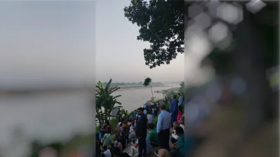 A large crowd of tourists gathered at the historic Tetulia Dak Bungalow viewpoint overlooking the Mahananda River. Perched roughly 15 to 20 meters above the riverbed, this colonial-era landmark offers a wide panorama of the river and the adjacent international border with India. Domestic travelers flock to this exact bank at dawn, hoping for a clear sky to catch a glimpse of the snow-capped peak of Mount Kanchenjunga.