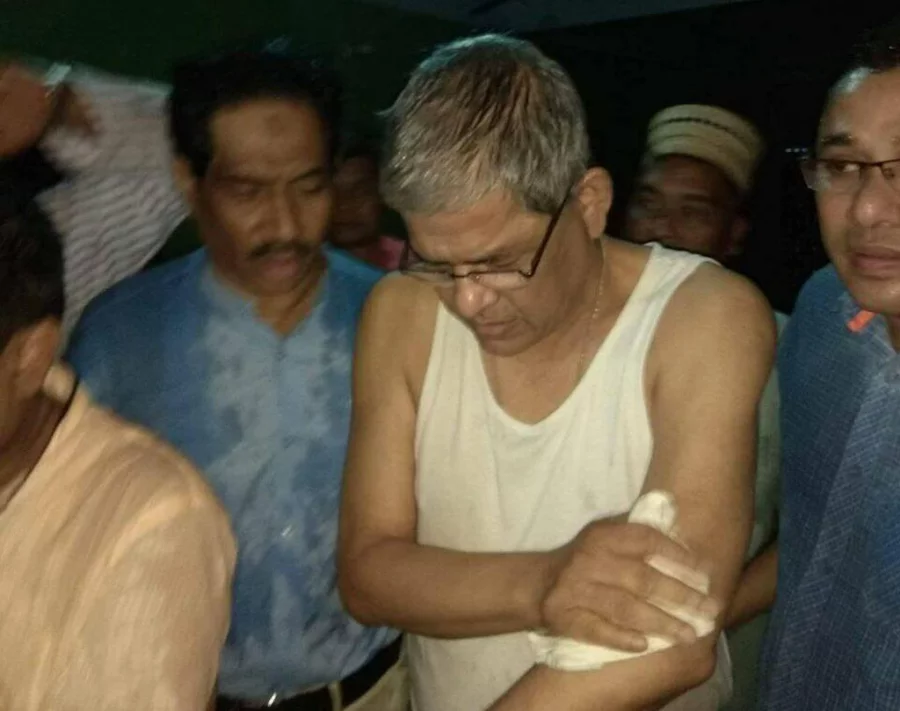 Injured Mirza fakhrul Islam Alamgir, escorted by his partymen, is seen taken away to an undisclosed location Collected