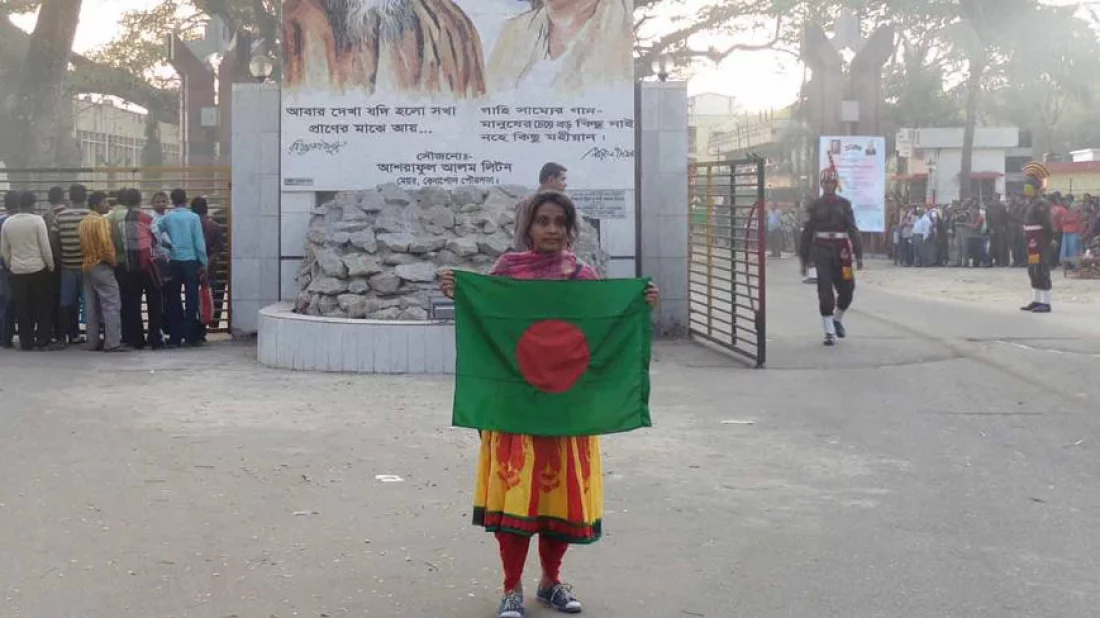 Jannatul Mawa Ruma walking with the national flag