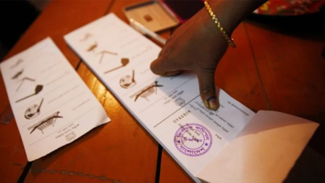 Undated image shows a voter casting vote through ballot paper. Photo: Dhaka Tribune