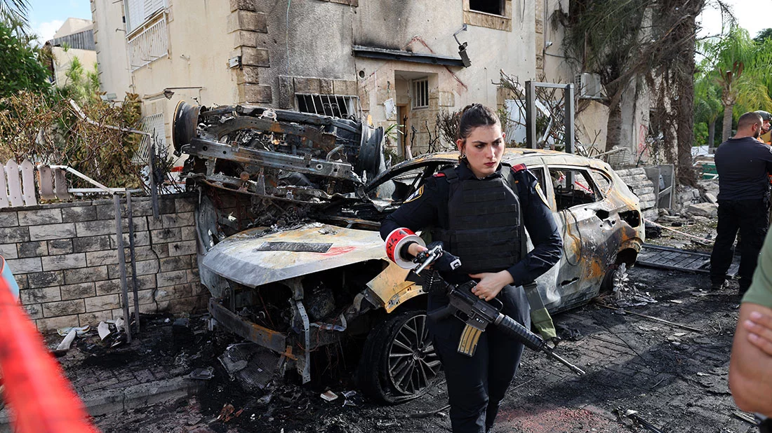 A member of the Israeli security forces stands guard inside a cordoned-off area in Kiryat Bialik in the Haifa district of Israel on September 22, 2024. Photo: AFP