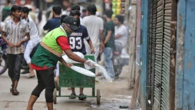 In pictures: DNCC, DSCC workers cleaning animal waste in Dhaka