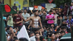 In pictures: Chants and banners against quota system fill Shahbagh