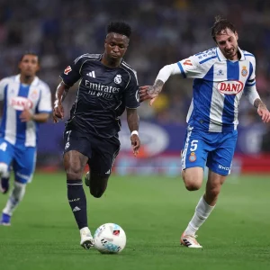 Vinicius double delays Barca title as Real down Espanyol