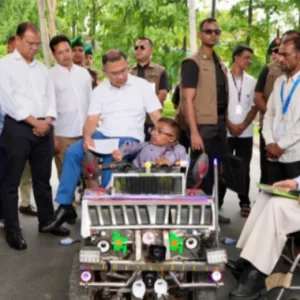 PM rides ‘smart car’ built by youth with disability