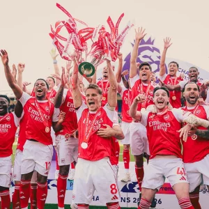 Arsenal lift Premier League trophy after beating Palace