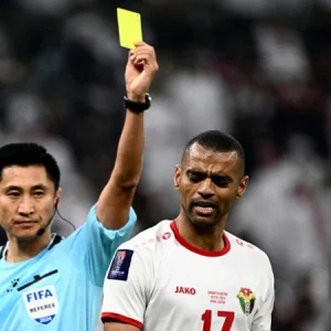 Success-starved China fans adopt 'Card Master' referee as Wo