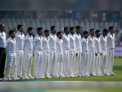 Bangladesh cricketers led by captain Mushfiqur Rahim stand for their national anthem prior to play on the first day of the Test cricket match between India and Bangladesh at The Rajiv Gandhi International Cricket Stadium in Hyderabad on February 9, 2017AFP
