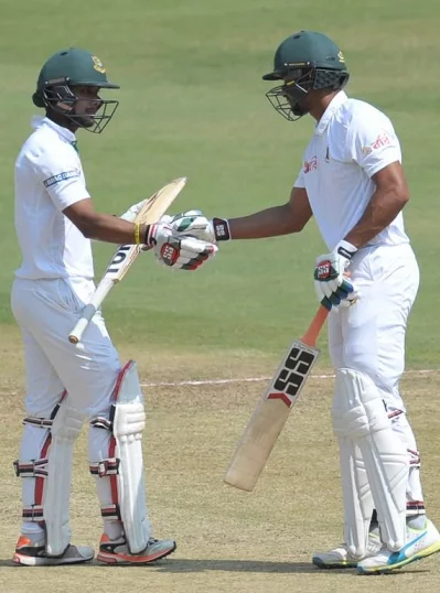 Bangladeshs Sabbir Rahman (L) congratulates teammate Mahmudullah (R) after his half century (50 runs) on the fifth day of a solo Test match between India and Bangladesh at the Rajiv Gandhi International Cricket Stadium  on February 13, 2017. AFP