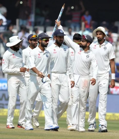 Indias captain Virat Kohli (2R) with teammates celebrate after winning a solo Test match against Bangladesh at the Rajiv Gandhi International Cricket Stadium on February 13, 2017. AFP