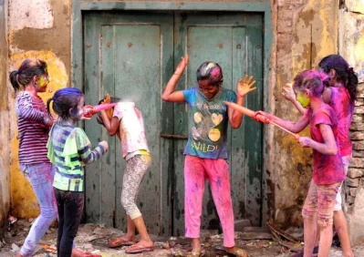 Indian revellers play with colours during Holi celebrations in Chennai on March 13, 2017. The Hindu festival of Holi, or the Festival of Colours heralds the arrival of spring and the end of winterrnrnAFP
