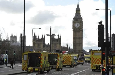 Members of the emergency services work to help vicitms on Westminster Bridge, alongside the Houses of Parliament in central London on March 22, 2017, during an emergency incident.rnBritish police shot a suspected attacker outside the Houses of Parliament in London on Wednesday after an officer was stabbed in what police said was a terrorist attackrnrnAFP