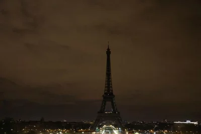 The lights of the Eiffel Tower are switched off at midnight in solidarity with the city of London following a terror attack on March 22, 2017.rnLights on the Eiffel Tower were switched off at midnight (2300 GMT) in solidarity with those killed and injured in a terror attack outside Britains parliament. The decision was taken by Paris Mayor Anne Hidalgo following the deadly attack in which a man ploughed his car into pedestrians on Londons Westminster Bridge then leapt out and stabbed a policeman, killing three people and wounding more than 20rnrnAFP