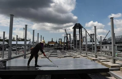 A construction worker paints metal beams at the construction site of the late Thai King Bhumibol Adulyadejs funeral pyre in front of the Grand Palace in Bangkok on March 31, 2017.rnThe exact date of the Kings funeral is not yet known, with Bhumibols heir, King Maha Vajiralongkorn, to decide on an auspicious time, expected to be in late 2017rnrnAFP