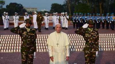 Pope Francis gestures after laying a floral wreath at the National Martyrs memorial of Bangladesh in Savar | AFP