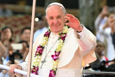 Pope Francis waves to Bangladeshi Christians as he arrives to lead mass in Dhaka on December 1, 2017 | AFP