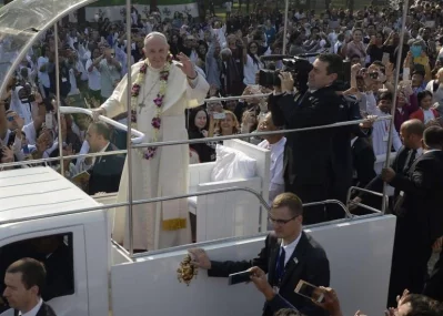 Pope Francis greets devotees as he arrives to lead mass for Bangladeshi Christians in Dhaka on December 1, 2017 | AFP