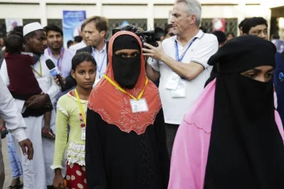 Rohingya refugees arrive at the Archbishops residence during a visit by Pope Francis in Dhaka on December 1, 2017 | AFP