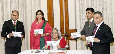 Prime Minister Sheikh Hasina releases the memorial postal stamp of Taka 10 denomination and its first day cover issued by Bangladesh Postal Department marking the Victory Day | Focus Bangla