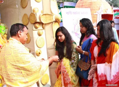 Female students gathered together before the idol of Saraswati and prayed for the blessing of knowledge. This photo was taken at Jagannath Hall in Dhaka University on Monday | Focus Bangla